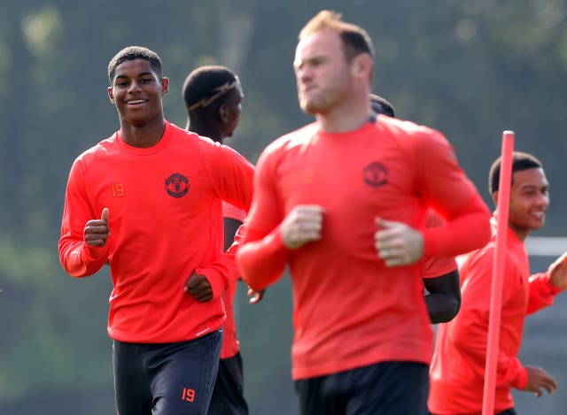 Wayne Rooney, right, wants Marcus Rashford to break his goalscoring record at Manchester United