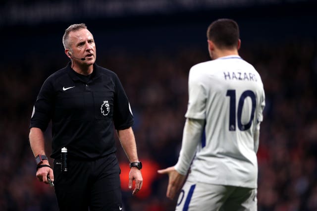 Match referee Jon Moss speaks to Chelsea’s Eden Hazard