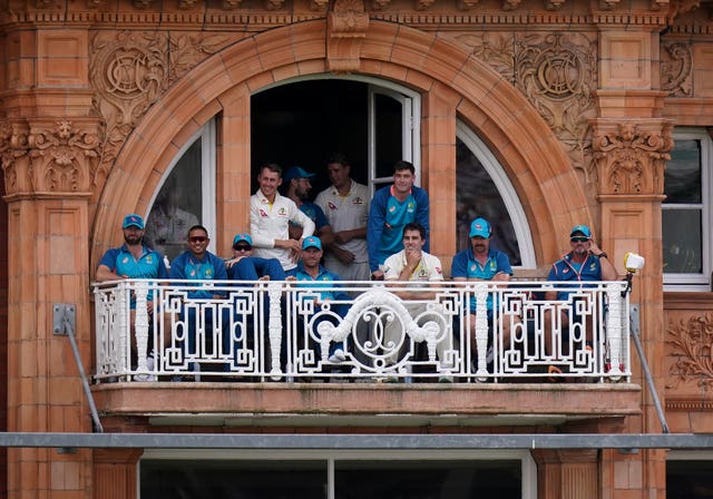 Australia players watch from the Lord's balcony during their team's second innings