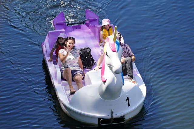 A family use a unicorn-themed pedalo on the River Avon in Warwick
