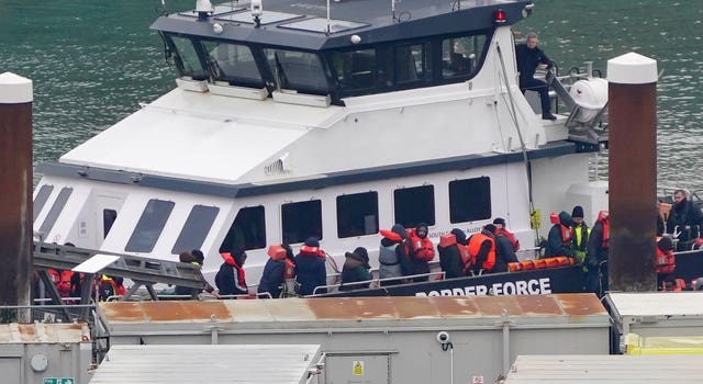 A group of people thought to be migrants being brought in to Dover, Kent, from a Border Force vessel following a small boat incident in the Channel