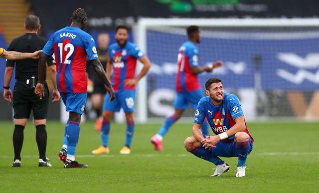Crystal Palace’s Joel Ward (right) sits dejected after the defeat by Everton