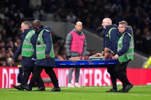 Savinho is carried off on a stretcher