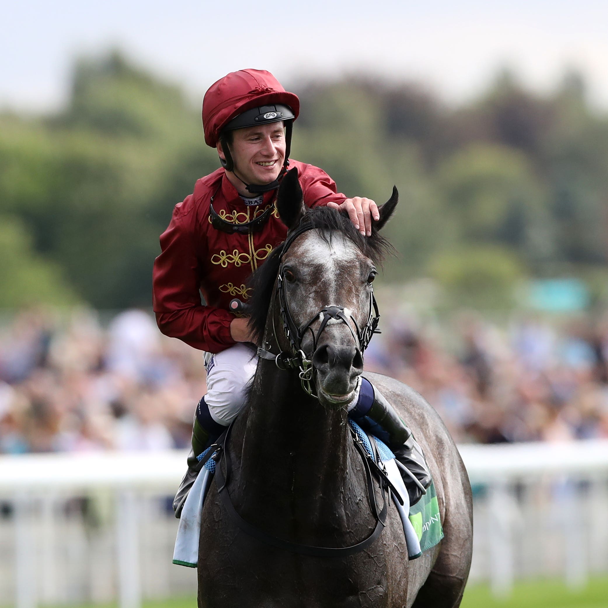 Oisin Murphy with Roaring Lion following the Juddmonte International