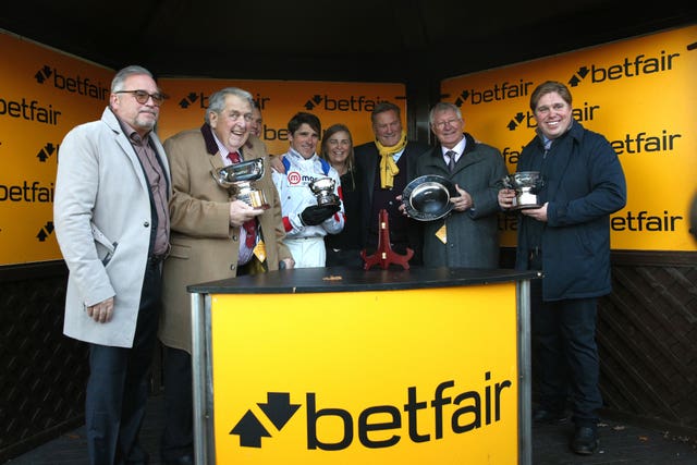 Sir Alex Ferguson (second right) on the podium after last year's Betfair Chase