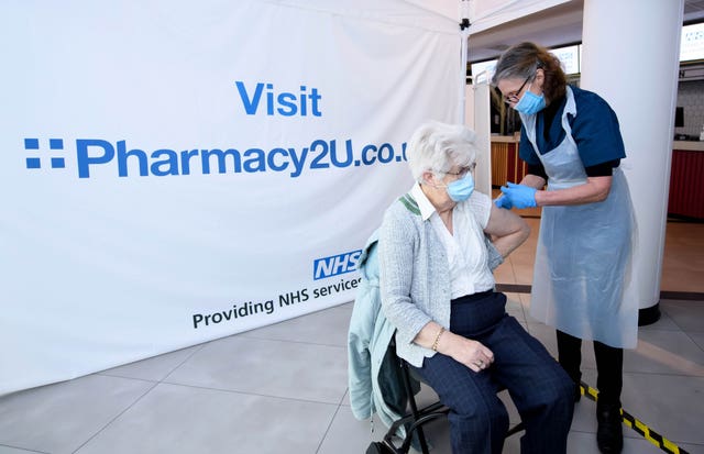 A vaccine is administered at the Odeon Cinema in Aylesbury (Jonathan Hordie/AP)