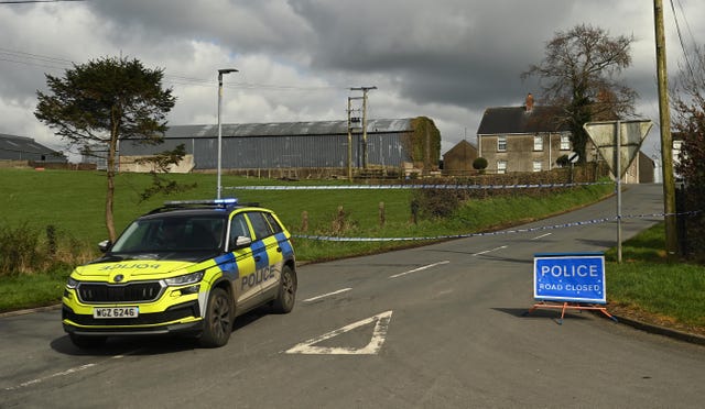 A police cordon remains at  Ballynahonemore Road 
