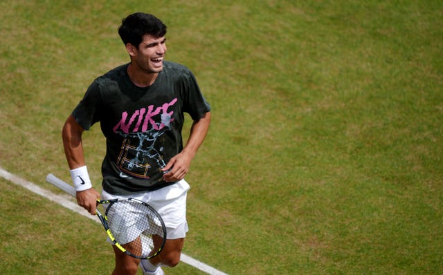 Carlos Alcaraz laughs in practice at Queen's Club