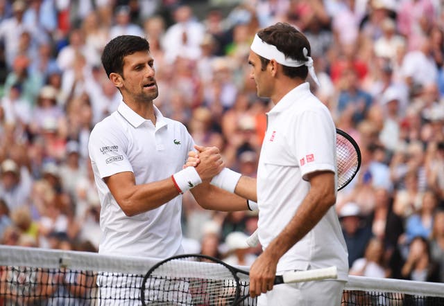 Novak Djokovic, left, and Roger Federer shake hands following their epic battle