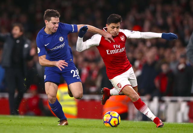 Chelsea’s Cesar Azpilicueta and Arsenal’s Alexis Sanchez battle for the ball