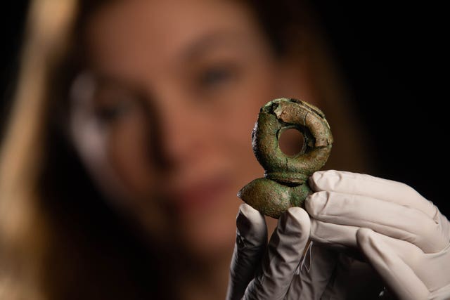 Curator Kate Sumnall examines a rare Terret Ring discovered in the Havering Hoard