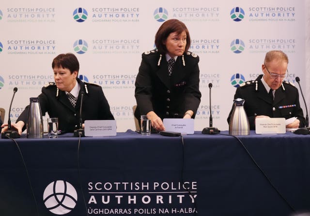 Jo Farrell standing flanked by fellow senior officers Jane Connors and Alan Speirs