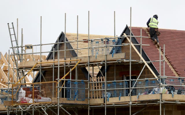 Builders on a roof