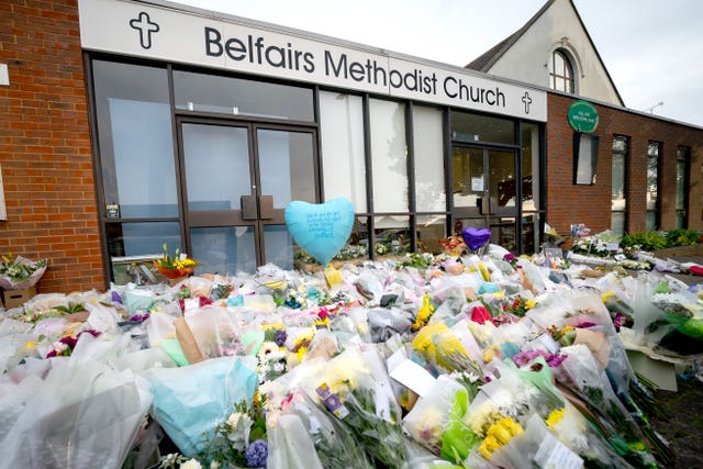 Flowers and tributes at the scene near Belfairs Methodist Church in Eastwood Road North, Leigh-on-Sea, Essex, where Conservative MP Sir David Amess died after he was stabbed several times at a constituency surgery in October 2021