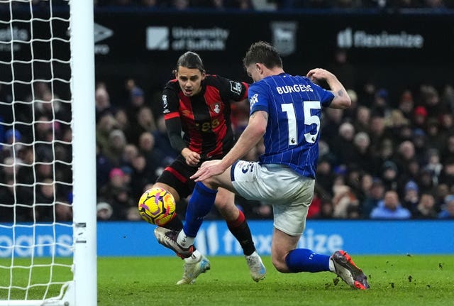 Enes Unal, left, scores Bournemouth’s equaliser against Ipswich