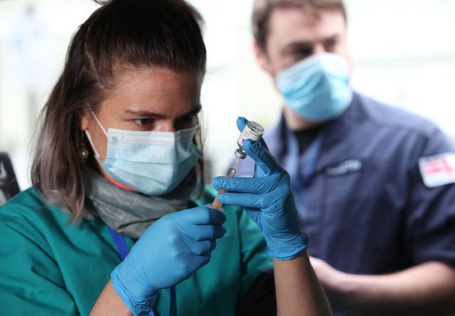 Medical student Leona Leipold prepares a dose of the vaccine (Yui Mok/PA)