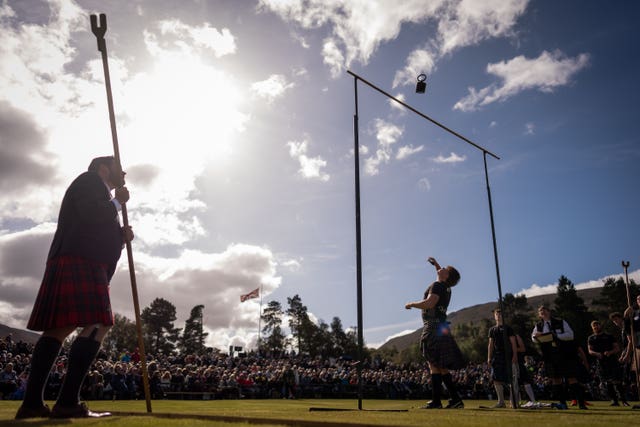 A person competes in the weight tossing category 
