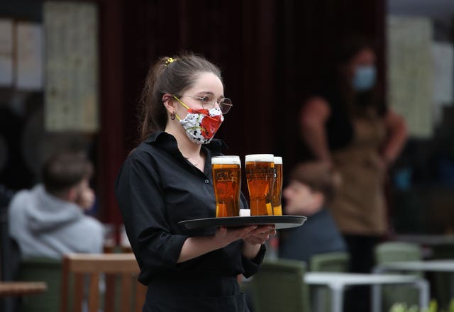 Woman serving beer