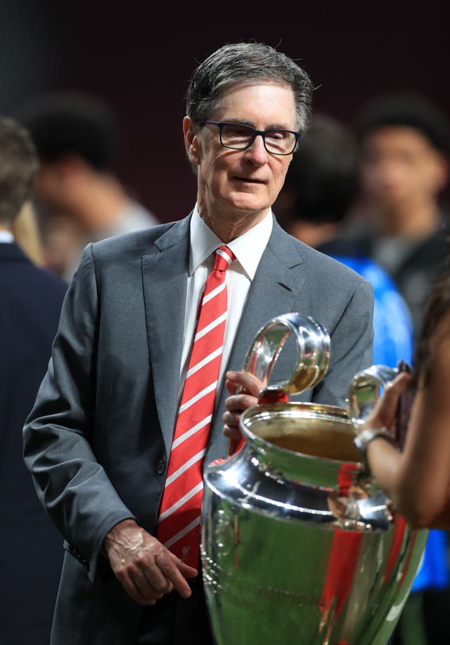 Liverpool owner John W Henry has called for further spending restrictions on Premier League clubs