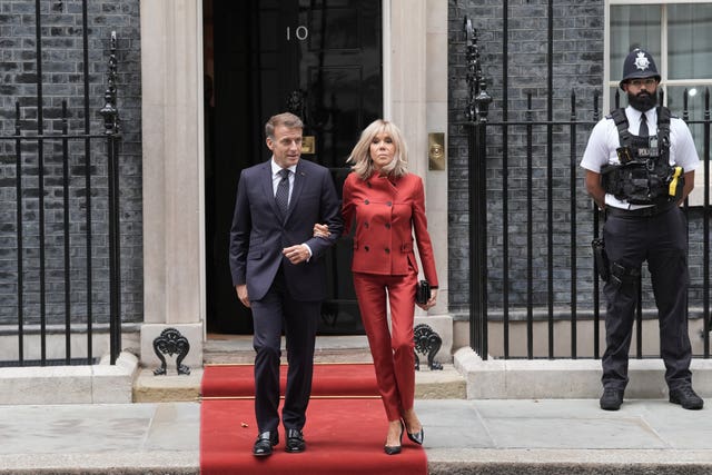 French President Emmanuel Macron and first lady Brigitte Macron leave Downing Street 