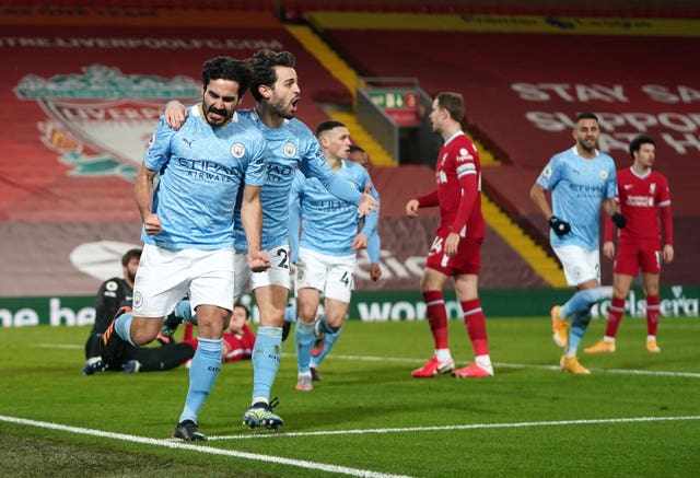 Ilkay Gundogan (left) scored twice as City finally won at Anfield