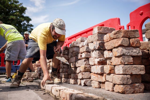 Wall being rebuilt 