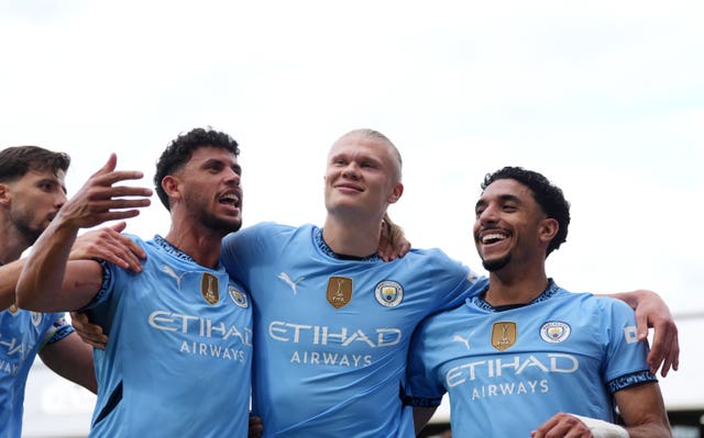 Erling Haaland celebrates scoring Manchester City's second goal at Fulham with his team-mates
