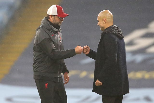 Liverpool manager Jurgen Klopp and Manchester City boss Pep Guardiola greet each other