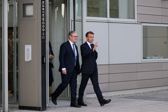 Sir Keir Starmer walking with Emmanuel Macron