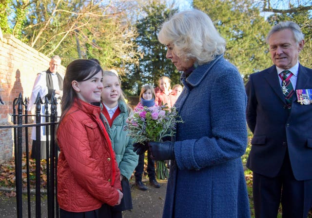 Camilla receives a posy of flowers