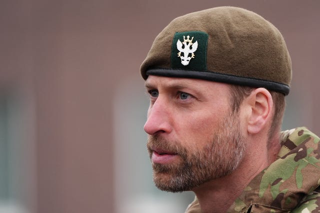 Headshot of Prince of Wales in Army fatigues and green beret