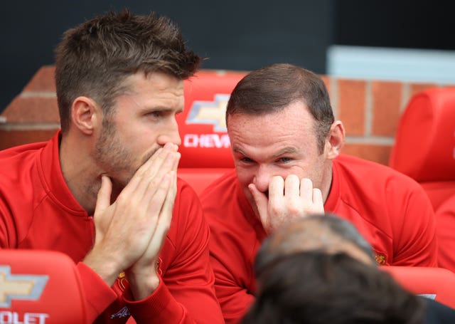 Wayne Rooney (right) on the Man Utd bench with Michael Carrick