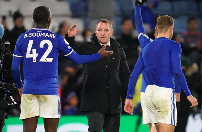 Brendan Rodgers, centre, congratulates his players after the game