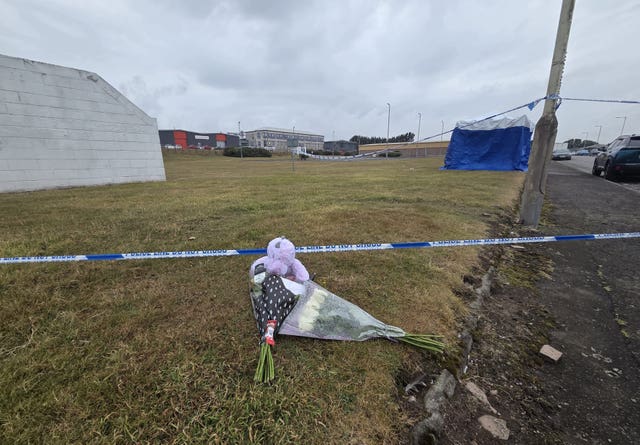 Floral tributes at industrial estate 