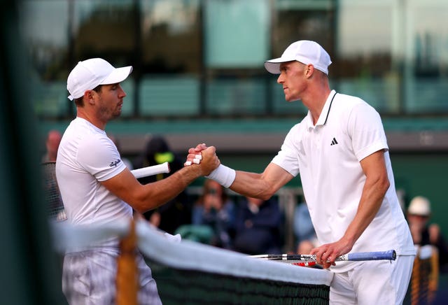 Jan Choinski (right) shakes hands with Dusan Lajovic 