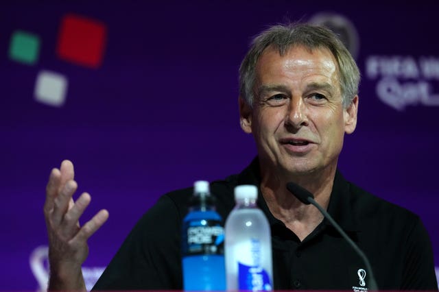 Klinsmann speaking at a Technical Study Group press conference on November 19