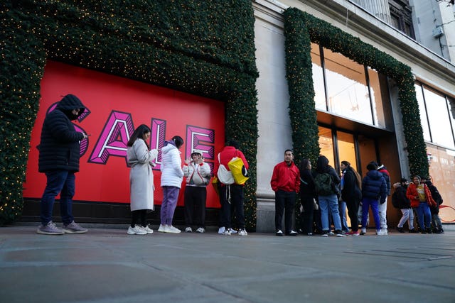 A small line of shoppers queueing at 8.30am outside Selfridges department store on London’s Oxford Street during the Boxing Day sales