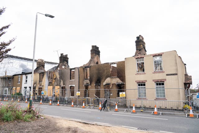 Fire-damaged homes in the village of Wennington in east London, a month after the wildfire on July 19 2022 (Dominic Lipinski/PA)