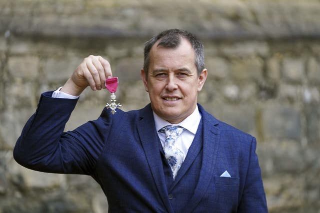 John McGuinness from Lancaster with his MBE  for services to motorcycle racing following an investiture ceremony by the Princess Royal at Windsor Castle 