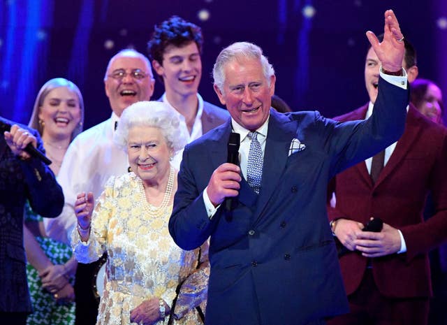 Charles leads in the audience in 'rousing cheers' for the Queen (John Stillwell/PA)