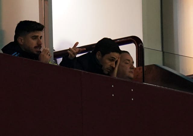 Arteta (centre) watched Arsenal's defeat at Villa Park from the stands