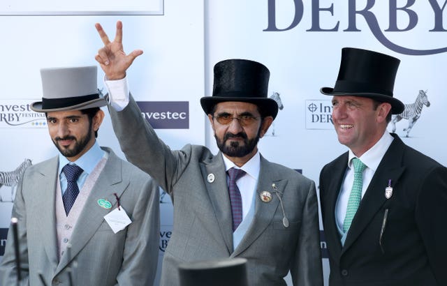 Charlie Appleby (right) is joined by Sheikh Mohammed (centre) and his son Hamdan bin Mohammed Al Maktoum on the winner's podium at Epsom