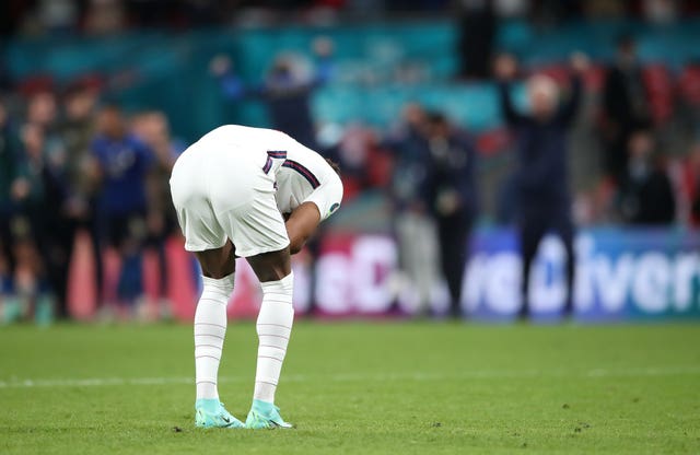 England's Marcus Rashford reacts after missing in the penalty shoot-out