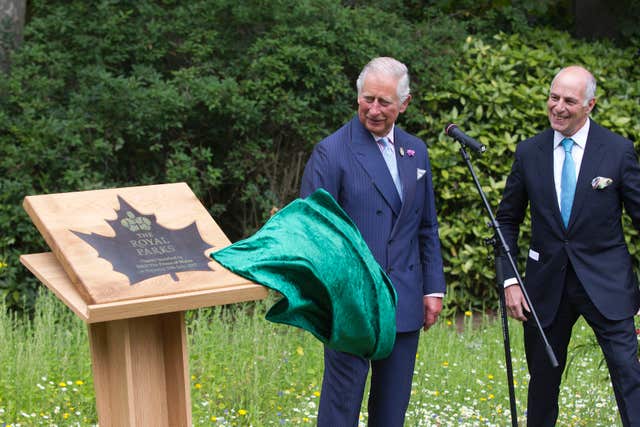 Charles unveiling a plaque with Loyd Grossman as he launches the new Royal Parks charity in Hyde Park, London