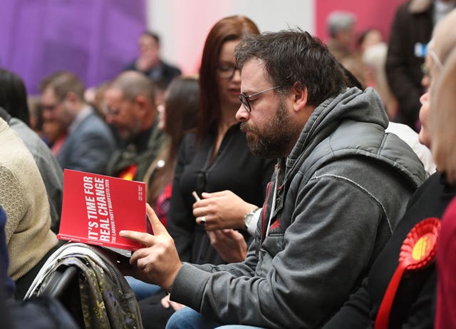 Man reads Labour manifesto