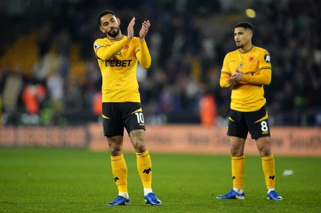 Wolves players applaud their fans