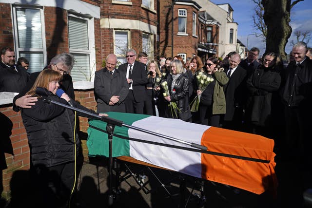 Brendan ‘Bik’ McFarlane’s wife Lene and daughter Tina speaking next to his coffin before it leaves his family home on Cliftonville Road, Belfast