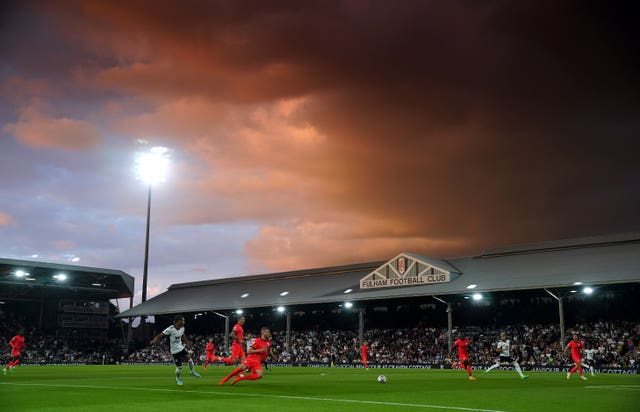 Bobby Decordova-Reid shoots as the sun sets at Craven Cottage