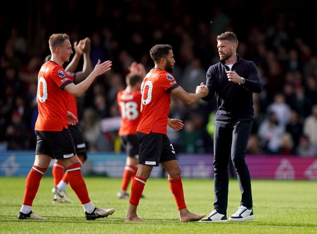 Luton manager Rob Edwards (right) congratulates his players at full-time