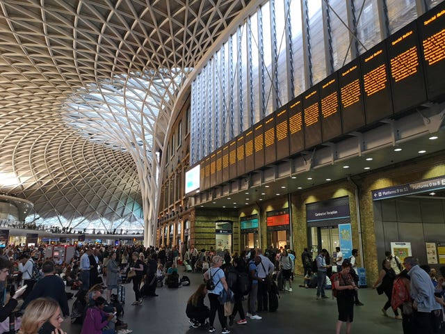 People waiting inside King's Cross station 